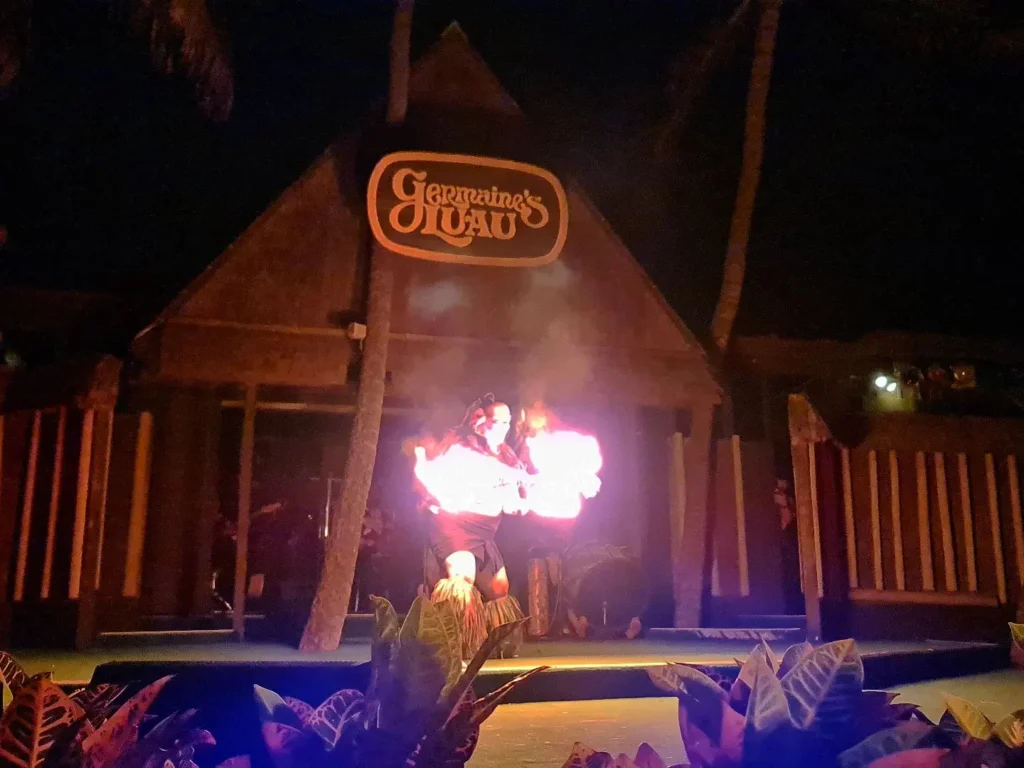 Cruising with Danny and Peter, Holland America Line, Koningsdam, Honolulu, Hawaii, United States | Breathtaking views from the Diamond Head summit during the hike, showcasing scenic views of Honolulu and Waikiki Beach, capturing the essence of volcano hiking in Hawaii, followed by a vibrant scene from Germaine's Luau, highlighting traditional Hawaiian feast, cultural events in Hawaii, and mesmerizing Hawaiian dance performances, all reflecting the rich Polynesian culture and Hawaiian hospitality.