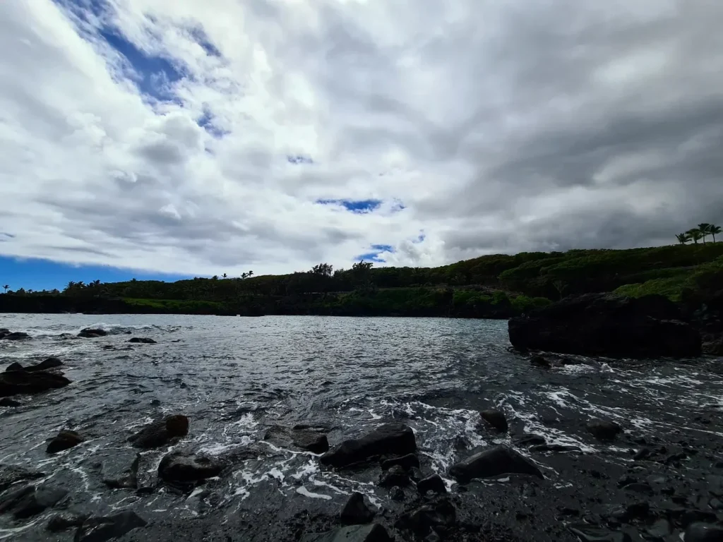 Cruising with Danny and Peter, Holland America Line, Koningsdam, Kahului, Maui, Hawaii, United States | Stunning views along the Road to Hana, showcasing Maui’s breathtaking waterfalls, lush Hana rainforest, captivating black sand beaches, and serene Turtle Beach Maui, with glimpses of whale watching opportunities and picturesque coastal views during this unforgettable Maui road trip adventure.