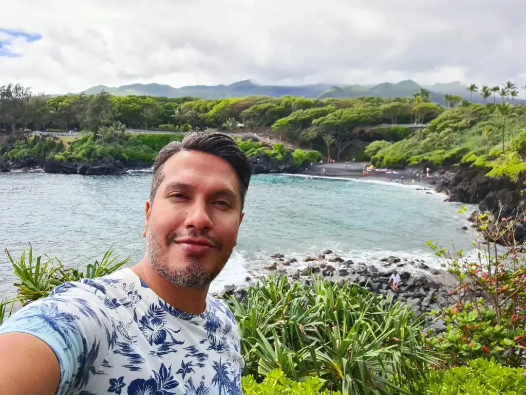 Cruising with Danny and Peter, Holland America Line, Koningsdam, Kahului, Maui, Hawaii, United States | Stunning views along the Road to Hana, showcasing Maui’s breathtaking waterfalls, lush Hana rainforest, captivating black sand beaches, and serene Turtle Beach Maui, with glimpses of whale watching opportunities and picturesque coastal views during this unforgettable Maui road trip adventure.