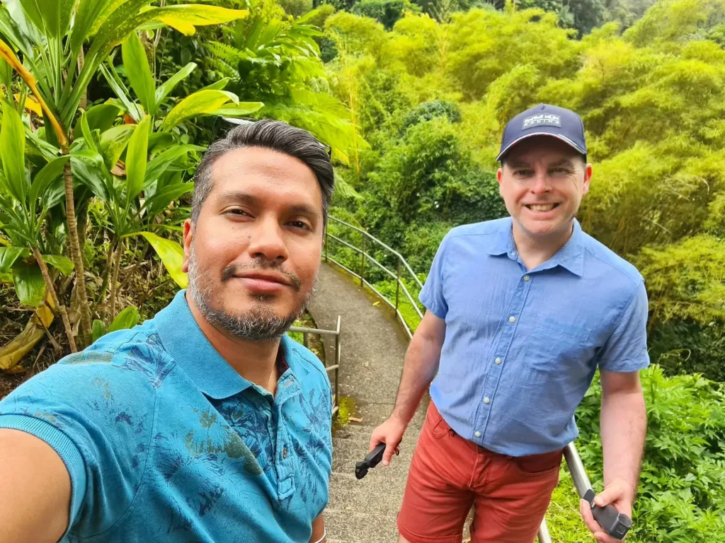 Cruising with Danny and Peter, Holland America Line, Koningsdam, Hilo, Hawaii, United States | Scenic Hamakua Coast Hilo Adventure in Hawaii featuring lush valleys, cascading waterfalls, hidden gems, and breathtaking ocean views along the tropical coastline.