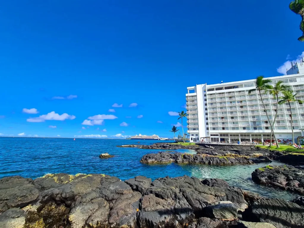 Cruising with Danny and Peter, Holland America Line, Koningsdam, Hilo, Hawaii, United States | Scenic Hamakua Coast Hilo Adventure in Hawaii featuring lush valleys, cascading waterfalls, hidden gems, and breathtaking ocean views along the tropical coastline.