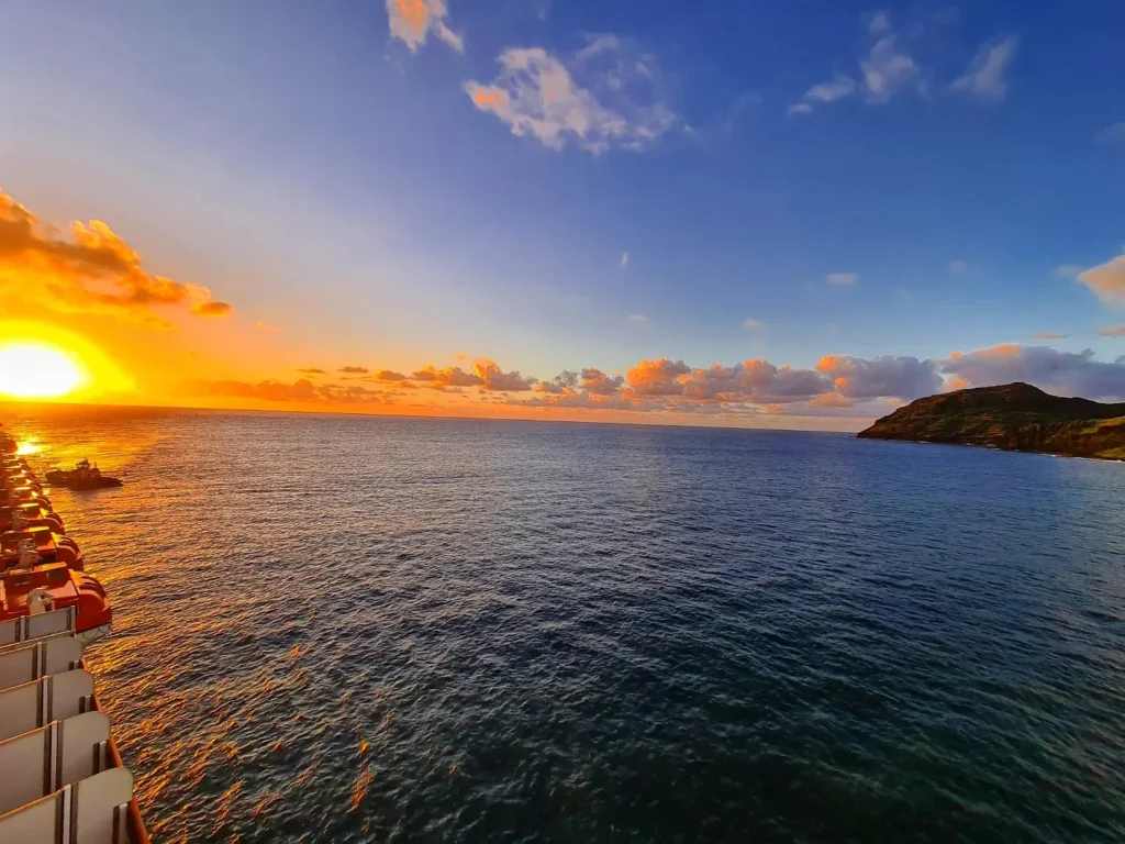 Cruising with Danny and Peter, Holland America Line, Koningsdam, Nawiliwili, Kauai, Hawaii, United States | Scenic views from the Nawiliwili Plantation Railway showcasing lush landscapes of Kauai, tropical fruit plantations, and historic plantation architecture, capturing the essence of a Hawaiian plantation experience.