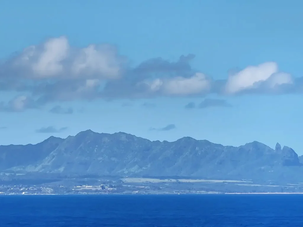 Cruising with Danny and Peter, Holland America Line, Koningsdam, Nawiliwili, Kauai, Hawaii, United States | Scenic views from the Nawiliwili Plantation Railway showcasing lush landscapes of Kauai, tropical fruit plantations, and historic plantation architecture, capturing the essence of a Hawaiian plantation experience.