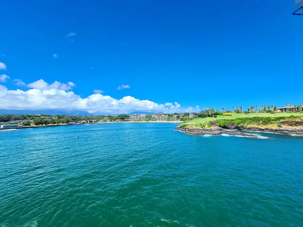 Cruising with Danny and Peter, Holland America Line, Koningsdam, Nawiliwili, Kauai, Hawaii, United States | Scenic views from the Nawiliwili Plantation Railway showcasing lush landscapes of Kauai, tropical fruit plantations, and historic plantation architecture, capturing the essence of a Hawaiian plantation experience.