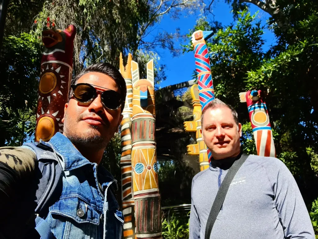 Cruising with Danny and Peter, Holland America Line, Koningsdam, San Diego, California, United States | Visitors enjoying wildlife exploration at the San Diego Zoo, featuring a variety of animals in lush exhibits. Includes close-ups of majestic lions, playful pandas, and other fascinating species. The image also shows people savoring delicious San Diego fish tacos, highlighting the coastal dining experience in San Diego.