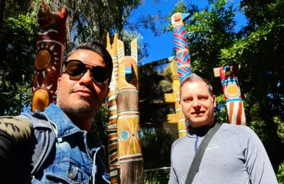 Discovering the Best of San Diego: Zoo Wildlife Exploration and Coastal Culinary Delights 8 Cruising with Danny and Peter, Holland America Line, Koningsdam, San Diego, California, United States | Visitors enjoying wildlife exploration at the San Diego Zoo, featuring a variety of animals in lush exhibits. Includes close-ups of majestic lions, playful pandas, and other fascinating species. The image also shows people savoring delicious San Diego fish tacos, highlighting the coastal dining experience in San Diego.