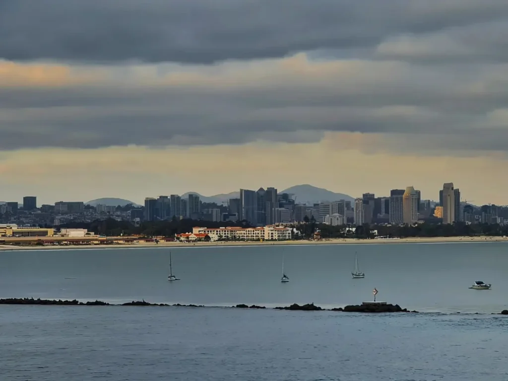 Cruising with Danny and Peter, Holland America Line, Koningsdam, San Diego, California, United States | Visitors enjoying wildlife exploration at the San Diego Zoo, featuring a variety of animals in lush exhibits. Includes close-ups of majestic lions, playful pandas, and other fascinating species. The image also shows people savoring delicious San Diego fish tacos, highlighting the coastal dining experience in San Diego.