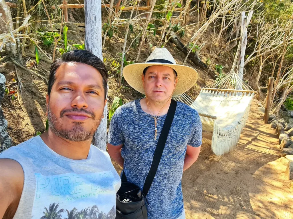 Cruising with Danny and Peter, Holland America Line, Koningsdam, Puerto Vallarta, Mexico | Las Caletas Beach in Puerto Vallarta featuring serene sandy shores, lush tropical greenery, and guests enjoying a relaxing beach day. The scene captures the essence of a secluded beach getaway with clear blue waters, vibrant Mexican cuisine, and the tranquil atmosphere of this hidden gem.
