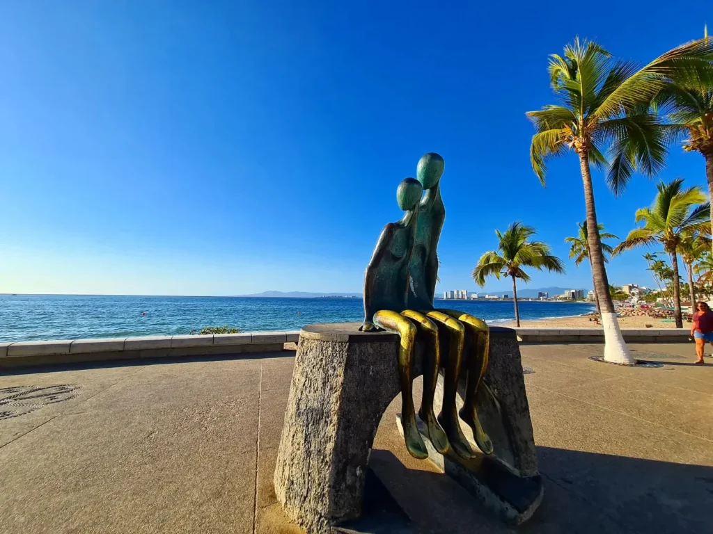 Cruising with Danny and Peter, Holland America Line, Koningsdam, Puerto Vallarta, Mexico | Las Caletas Beach in Puerto Vallarta featuring serene sandy shores, lush tropical greenery, and guests enjoying a relaxing beach day. The scene captures the essence of a secluded beach getaway with clear blue waters, vibrant Mexican cuisine, and the tranquil atmosphere of this hidden gem.