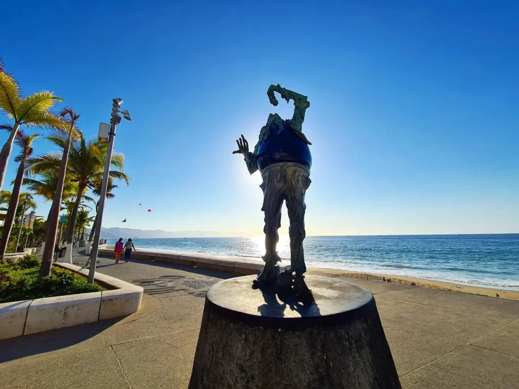 Cruising with Danny and Peter, Holland America Line, Koningsdam, Puerto Vallarta, Mexico | Las Caletas Beach in Puerto Vallarta featuring serene sandy shores, lush tropical greenery, and guests enjoying a relaxing beach day. The scene captures the essence of a secluded beach getaway with clear blue waters, vibrant Mexican cuisine, and the tranquil atmosphere of this hidden gem.