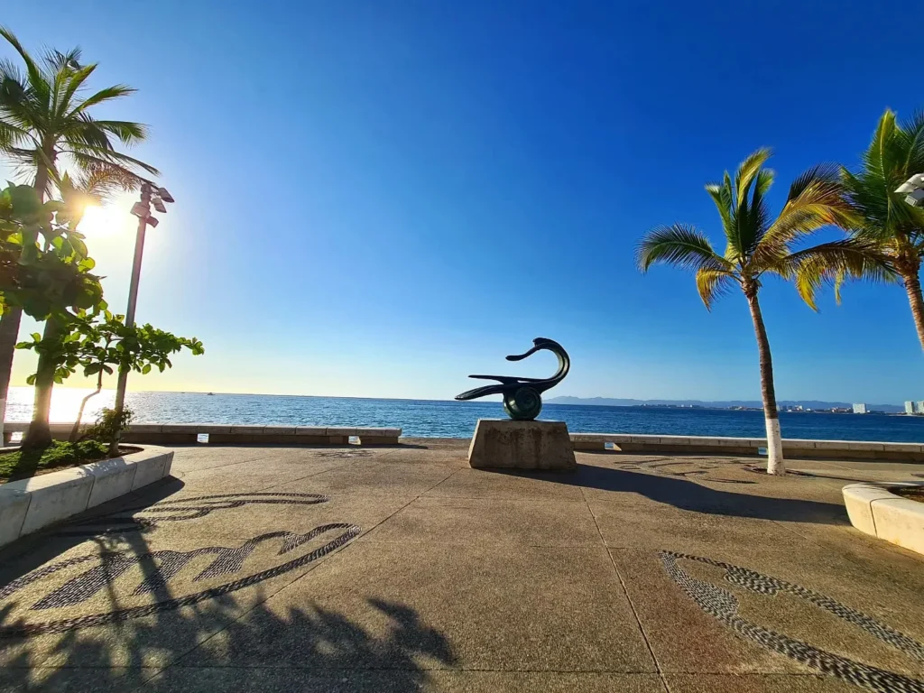 Cruising with Danny and Peter, Holland America Line, Koningsdam, Puerto Vallarta, Mexico | Las Caletas Beach in Puerto Vallarta featuring serene sandy shores, lush tropical greenery, and guests enjoying a relaxing beach day. The scene captures the essence of a secluded beach getaway with clear blue waters, vibrant Mexican cuisine, and the tranquil atmosphere of this hidden gem.