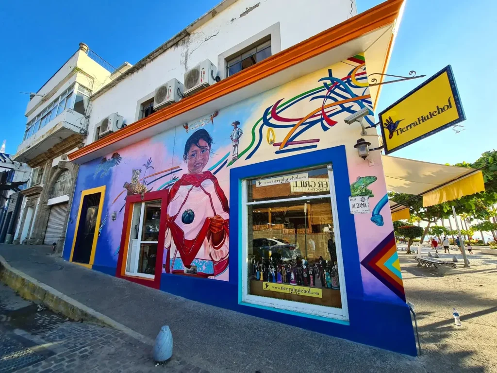 Cruising with Danny and Peter, Holland America Line, Koningsdam, Puerto Vallarta, Mexico | Las Caletas Beach in Puerto Vallarta featuring serene sandy shores, lush tropical greenery, and guests enjoying a relaxing beach day. The scene captures the essence of a secluded beach getaway with clear blue waters, vibrant Mexican cuisine, and the tranquil atmosphere of this hidden gem.