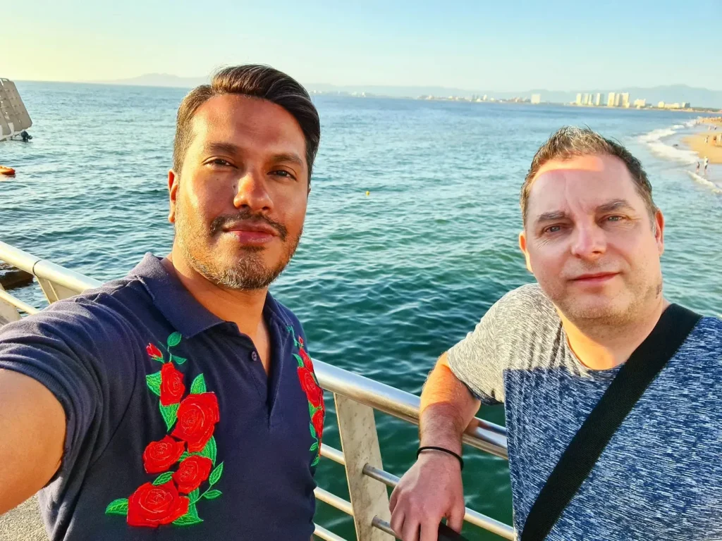 Cruising with Danny and Peter, Holland America Line, Koningsdam, Puerto Vallarta, Mexico | Las Caletas Beach in Puerto Vallarta featuring serene sandy shores, lush tropical greenery, and guests enjoying a relaxing beach day. The scene captures the essence of a secluded beach getaway with clear blue waters, vibrant Mexican cuisine, and the tranquil atmosphere of this hidden gem.