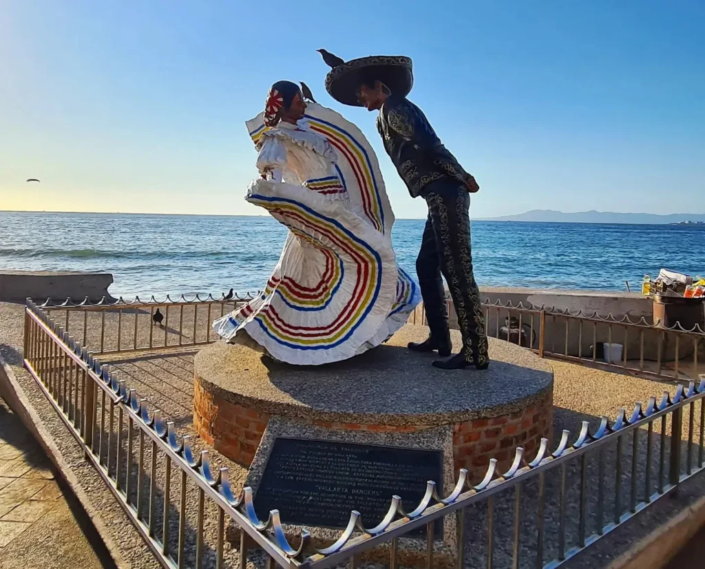 Cruising with Danny and Peter, Holland America Line, Koningsdam, Puerto Vallarta, Mexico | Las Caletas Beach in Puerto Vallarta featuring serene sandy shores, lush tropical greenery, and guests enjoying a relaxing beach day. The scene captures the essence of a secluded beach getaway with clear blue waters, vibrant Mexican cuisine, and the tranquil atmosphere of this hidden gem.