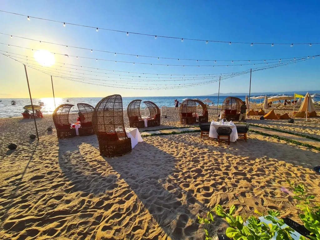 Cruising with Danny and Peter, Holland America Line, Koningsdam, Puerto Vallarta, Mexico | Las Caletas Beach in Puerto Vallarta featuring serene sandy shores, lush tropical greenery, and guests enjoying a relaxing beach day. The scene captures the essence of a secluded beach getaway with clear blue waters, vibrant Mexican cuisine, and the tranquil atmosphere of this hidden gem.