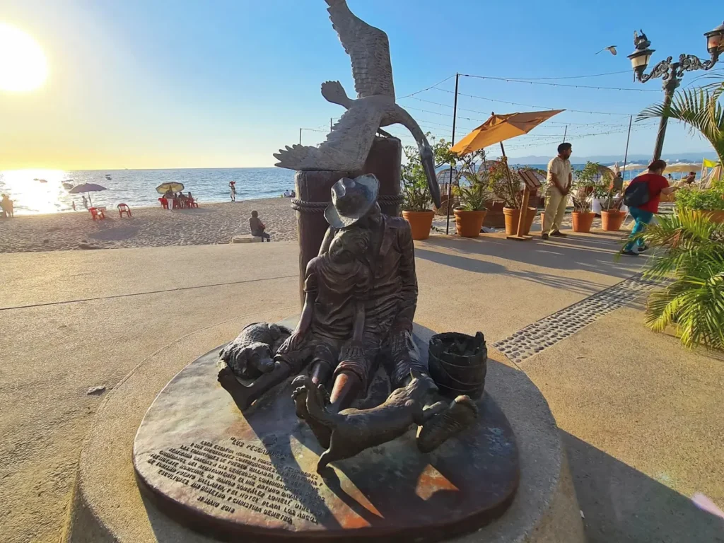 Cruising with Danny and Peter, Holland America Line, Koningsdam, Puerto Vallarta, Mexico | Las Caletas Beach in Puerto Vallarta featuring serene sandy shores, lush tropical greenery, and guests enjoying a relaxing beach day. The scene captures the essence of a secluded beach getaway with clear blue waters, vibrant Mexican cuisine, and the tranquil atmosphere of this hidden gem.