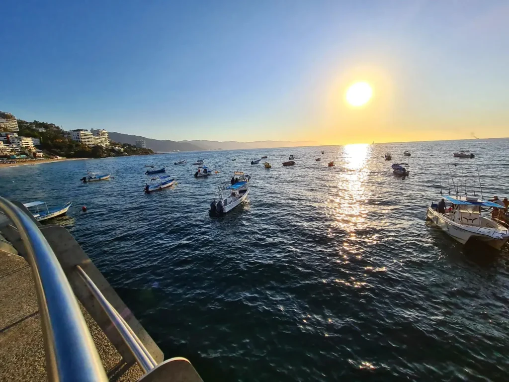 Cruising with Danny and Peter, Holland America Line, Koningsdam, Puerto Vallarta, Mexico | Las Caletas Beach in Puerto Vallarta featuring serene sandy shores, lush tropical greenery, and guests enjoying a relaxing beach day. The scene captures the essence of a secluded beach getaway with clear blue waters, vibrant Mexican cuisine, and the tranquil atmosphere of this hidden gem.