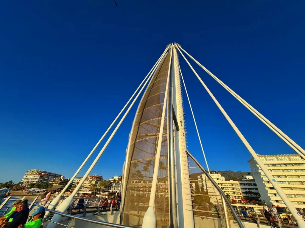 Cruising with Danny and Peter, Holland America Line, Koningsdam, Puerto Vallarta, Mexico | Las Caletas Beach in Puerto Vallarta featuring serene sandy shores, lush tropical greenery, and guests enjoying a relaxing beach day. The scene captures the essence of a secluded beach getaway with clear blue waters, vibrant Mexican cuisine, and the tranquil atmosphere of this hidden gem.