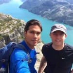 Cruising with Danny and Peter, Holland America Line, Zuiderdam, Stavanger, Norway | Hiking to Preikestolen Norway with scenic views from Pulpit Rock summit, showcasing stunning fjords, dramatic cliffs, and panoramic landscapes during the trek.