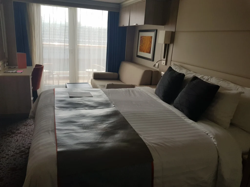 Cruising with Danny and Peter, Holland America Line, Koningsdam, Civiatavecchia, Rome, Italy | Guests enjoying a luxurious evening on the Koningsdam during the Ancient Empires Cruise, with views of the Mediterranean Sea, exploring historical sites in Greece, and indulging in exquisite dining experiences that highlight local cuisine.