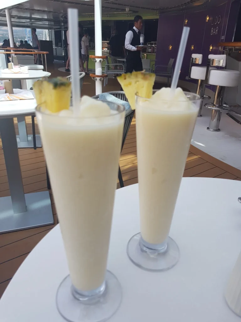 Cruising with Danny and Peter, Holland America Line, Koningsdam, Civiatavecchia, Rome, Italy | Guests enjoying a luxurious evening on the Koningsdam during the Ancient Empires Cruise, with views of the Mediterranean Sea, exploring historical sites in Greece, and indulging in exquisite dining experiences that highlight local cuisine.