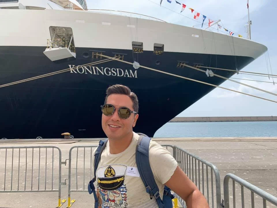 Cruising with Danny and Peter, Holland America Line, Koningsdam, Civiatavecchia, Rome, Italy | Guests enjoying a luxurious evening on the Koningsdam during the Ancient Empires Cruise, with views of the Mediterranean Sea, exploring historical sites in Greece, and indulging in exquisite dining experiences that highlight local cuisine.