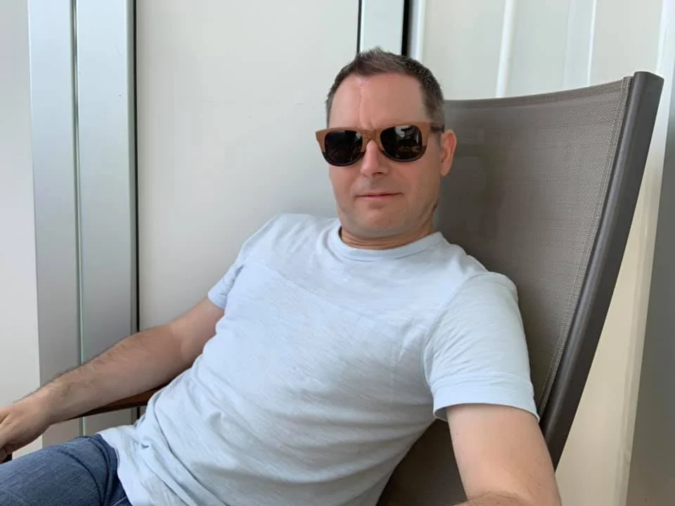 Cruising with Danny and Peter, Holland America Line, Koningsdam, Sea Day | Scenic view from a Mediterranean Cruise ship with sunbathers enjoying a Relaxing Day at Sea and the Stromboli Volcano in the background