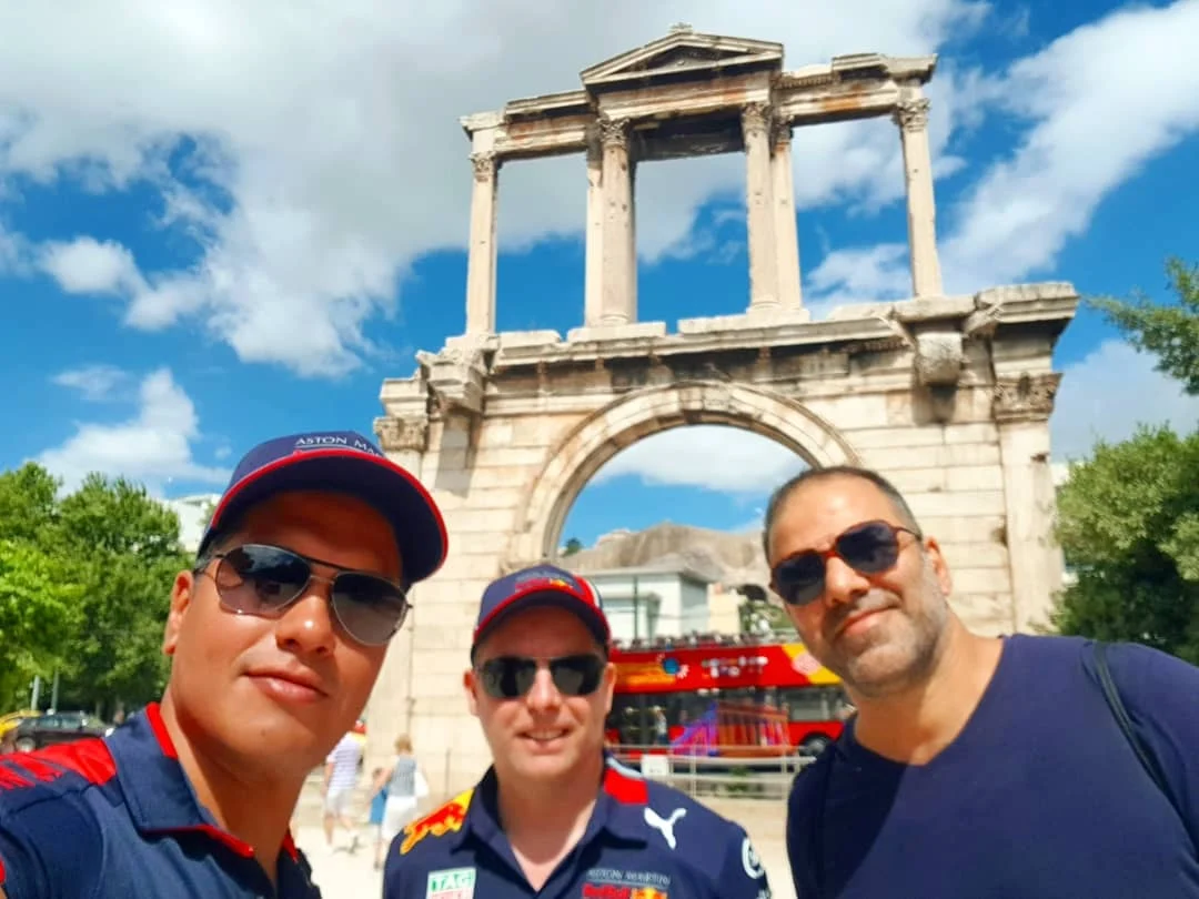 Cruising with Danny and Peter, Holland America Line, Koningsdam, Piraeus, Athens, Greece | A vibrant street art mural in Athens, showcasing the city's artistic spirit, with the Acropolis in the background; a local café offering panoramic views, perfect for an Athens Instagram Tour; hidden gems of Athens, including narrow alleys and quaint courtyards filled with history and charm.