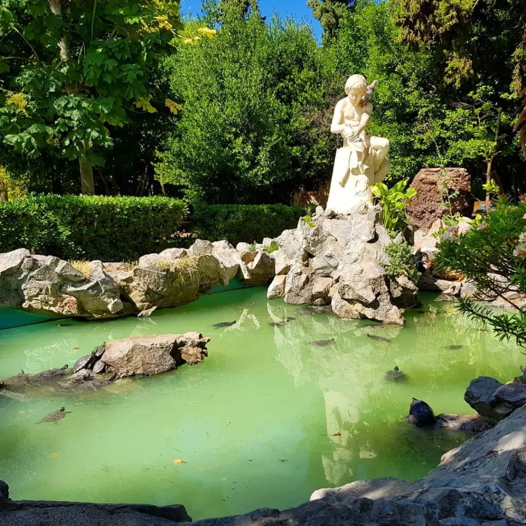 Cruising with Danny and Peter, Holland America Line, Koningsdam, Piraeus, Athens, Greece | A vibrant street art mural in Athens, showcasing the city's artistic spirit, with the Acropolis in the background; a local café offering panoramic views, perfect for an Athens Instagram Tour; hidden gems of Athens, including narrow alleys and quaint courtyards filled with history and charm.