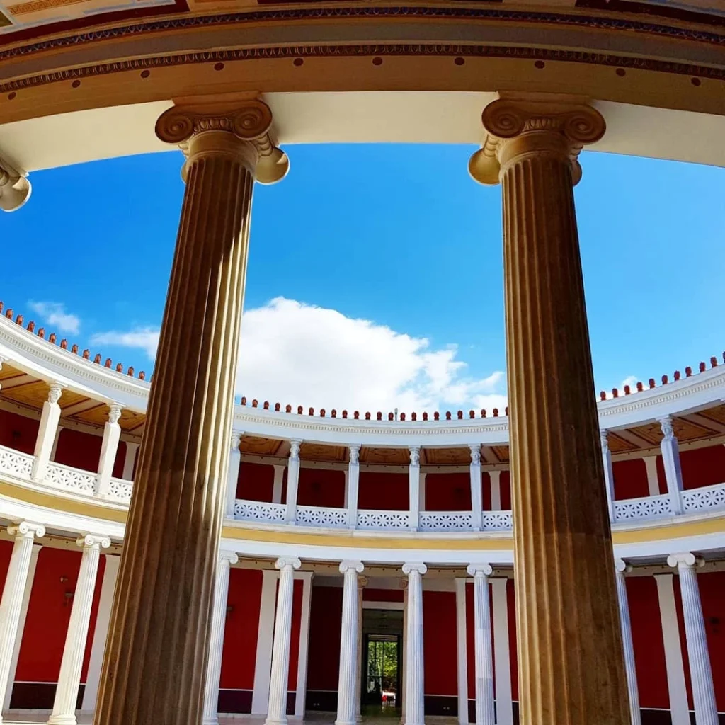 Cruising with Danny and Peter, Holland America Line, Koningsdam, Piraeus, Athens, Greece | A vibrant street art mural in Athens, showcasing the city's artistic spirit, with the Acropolis in the background; a local café offering panoramic views, perfect for an Athens Instagram Tour; hidden gems of Athens, including narrow alleys and quaint courtyards filled with history and charm.