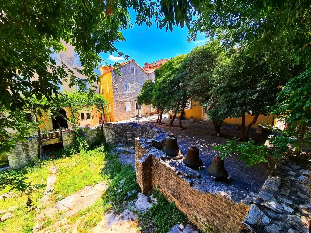 Cruising with Danny and Peter, Holland America Line, Oosterdam, Kotor, Montenegro | Stunning view of Kotor Bay, showcasing the charming villages and scenic beaches of Montenegro. The image features the medieval architecture of Budva Old Town, the crystal-clear waters of Jaz Beach, and the picturesque landscapes of Brajići, highlighting the cultural heritage and natural beauty of the Adriatic Coast.