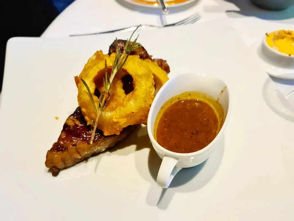 Cruising with Danny and Peter, Holland America Line, Oosterdam, Kotor, Montenegro | Stunning view of Kotor Bay, showcasing the charming villages and scenic beaches of Montenegro. The image features the medieval architecture of Budva Old Town, the crystal-clear waters of Jaz Beach, and the picturesque landscapes of Brajići, highlighting the cultural heritage and natural beauty of the Adriatic Coast.