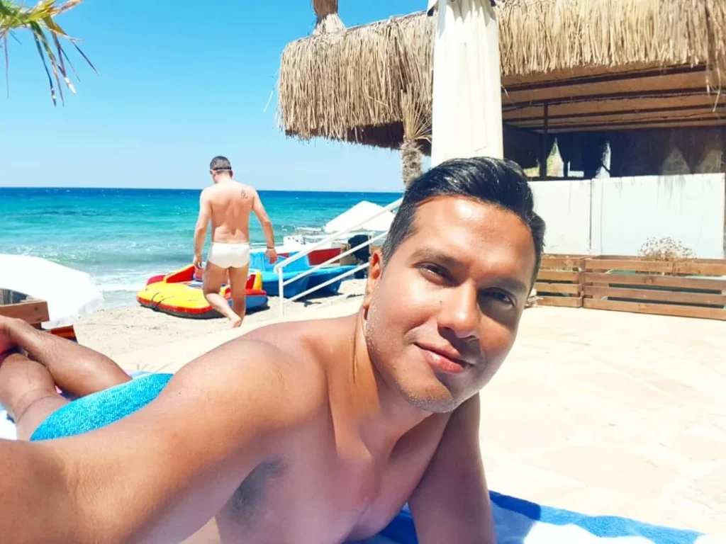 Cruising with Danny and Peter, Holland America Line, Koningsdam, Kusadasi, Ephesus, Turkey | A picturesque view of Kuşadası Beach showcasing soft golden sands and crystal-clear Aegean Sea waters, vibrant local markets filled with traditional Turkish crafts, and visitors savoring authentic Turkish cuisine at a charming café, highlighting the cultural exploration and seaside relaxation of a perfect Kuşadası Beach Day on the Turkish Riviera.