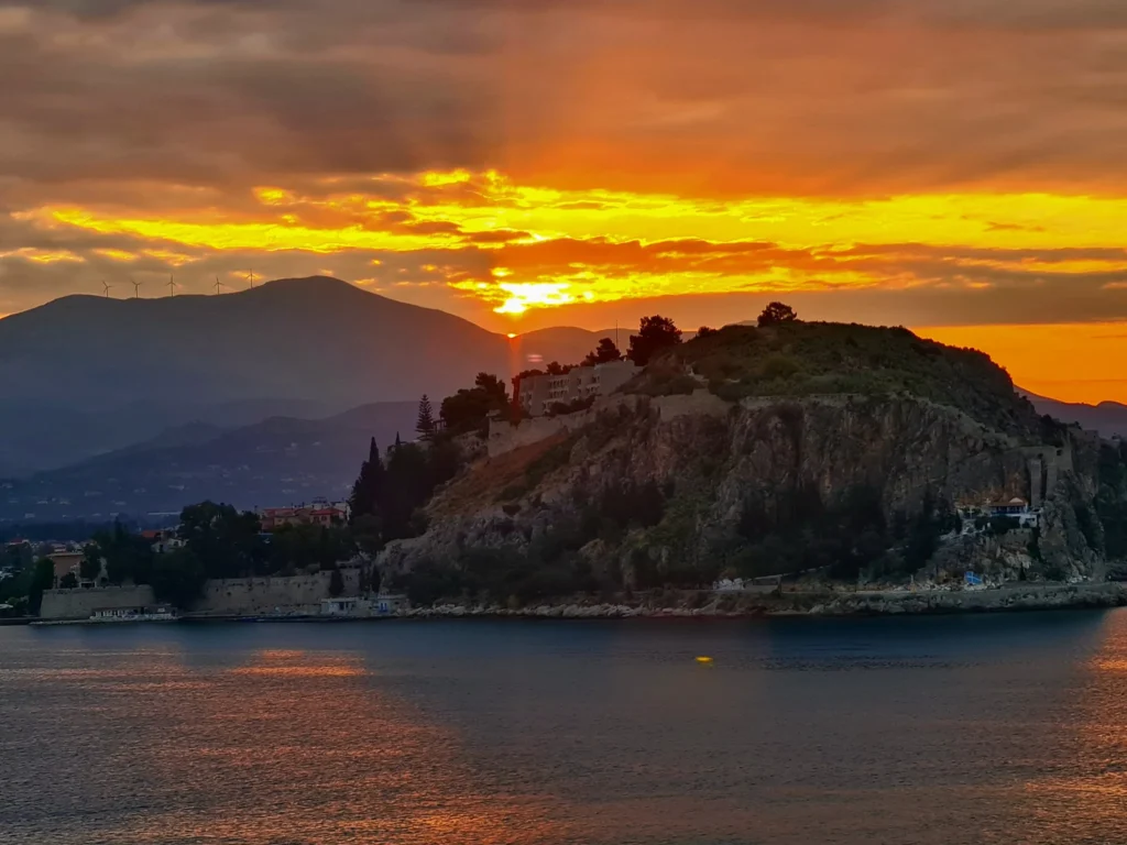 Cruising with Danny and Peter, Holland America Line, Oosterdam, Nafplion, Greece | Explore the ancient ruins of Mycenae and Epidaurus in Greece, featuring the iconic Lion Gate of Mycenae, the tomb of King Agamemnon, and the Epidaurus Theater with its renowned acoustics. Experience the rich cultural heritage of Ancient Greek architecture and discover these UNESCO World Heritage Peloponnese archaeological sites. Complete your journey with stunning views of the Venetian fortress in Náfplion, showcasing Greece's timeless history and architectural marvels.