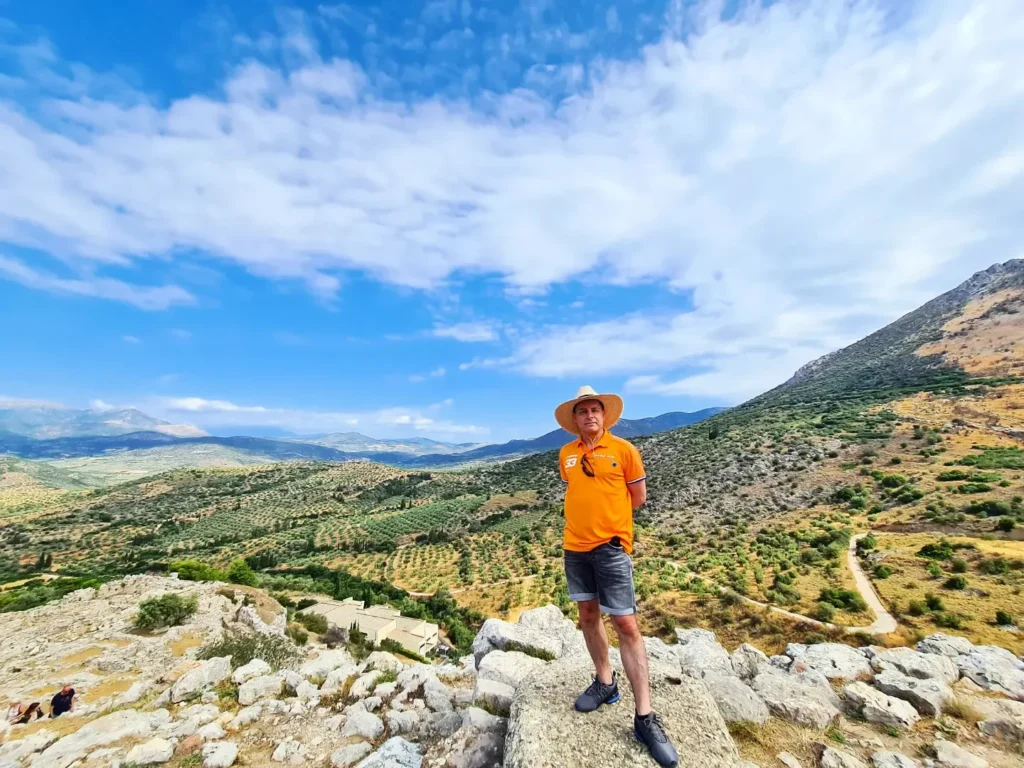 Cruising with Danny and Peter, Holland America Line, Oosterdam, Nafplion, Greece | Explore the ancient ruins of Mycenae and Epidaurus in Greece, featuring the iconic Lion Gate of Mycenae, the tomb of King Agamemnon, and the Epidaurus Theater with its renowned acoustics. Experience the rich cultural heritage of Ancient Greek architecture and discover these UNESCO World Heritage Peloponnese archaeological sites. Complete your journey with stunning views of the Venetian fortress in Náfplion, showcasing Greece's timeless history and architectural marvels.