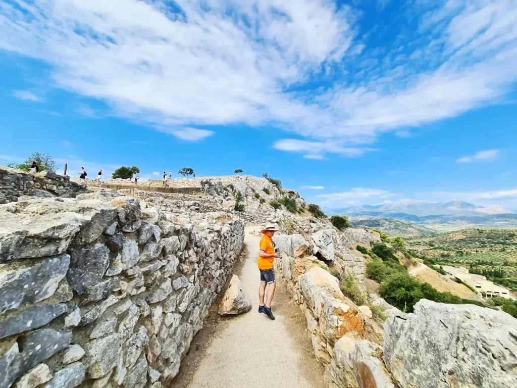 Cruising with Danny and Peter, Holland America Line, Oosterdam, Nafplion, Greece | Explore the ancient ruins of Mycenae and Epidaurus in Greece, featuring the iconic Lion Gate of Mycenae, the tomb of King Agamemnon, and the Epidaurus Theater with its renowned acoustics. Experience the rich cultural heritage of Ancient Greek architecture and discover these UNESCO World Heritage Peloponnese archaeological sites. Complete your journey with stunning views of the Venetian fortress in Náfplion, showcasing Greece's timeless history and architectural marvels.
