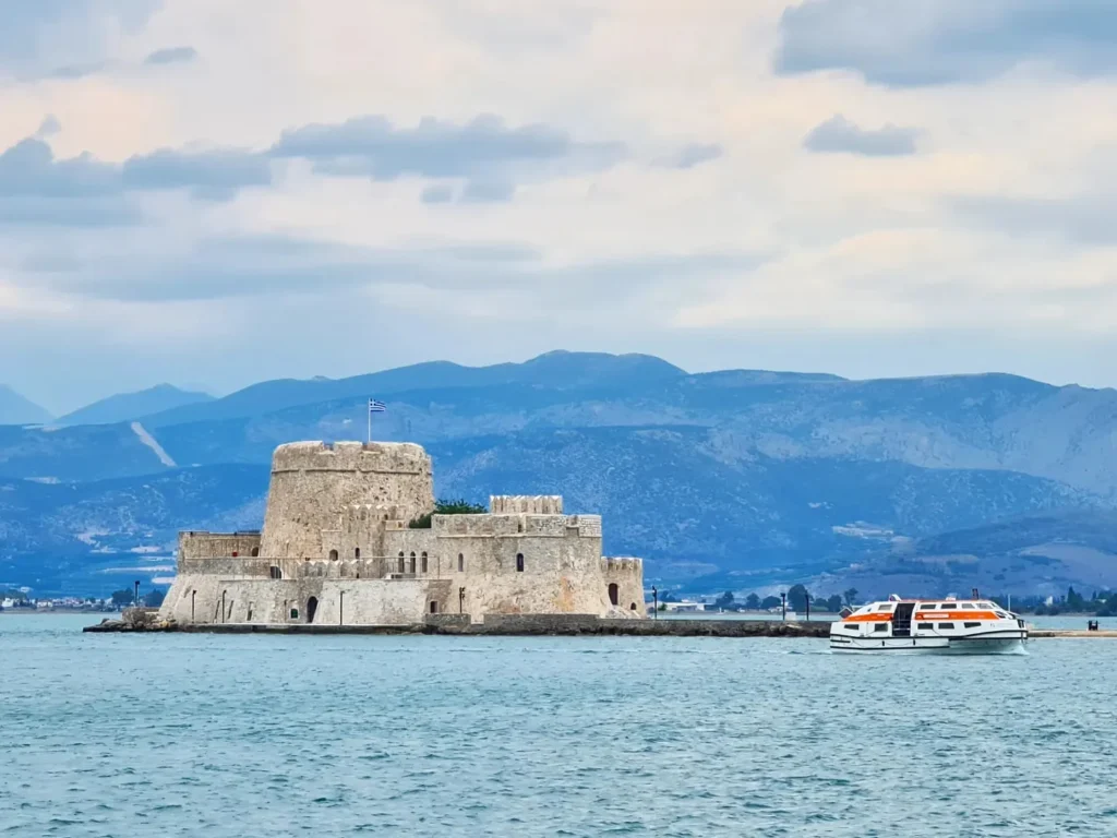 Cruising with Danny and Peter, Holland America Line, Oosterdam, Nafplion, Greece | Explore the ancient ruins of Mycenae and Epidaurus in Greece, featuring the iconic Lion Gate of Mycenae, the tomb of King Agamemnon, and the Epidaurus Theater with its renowned acoustics. Experience the rich cultural heritage of Ancient Greek architecture and discover these UNESCO World Heritage Peloponnese archaeological sites. Complete your journey with stunning views of the Venetian fortress in Náfplion, showcasing Greece's timeless history and architectural marvels.