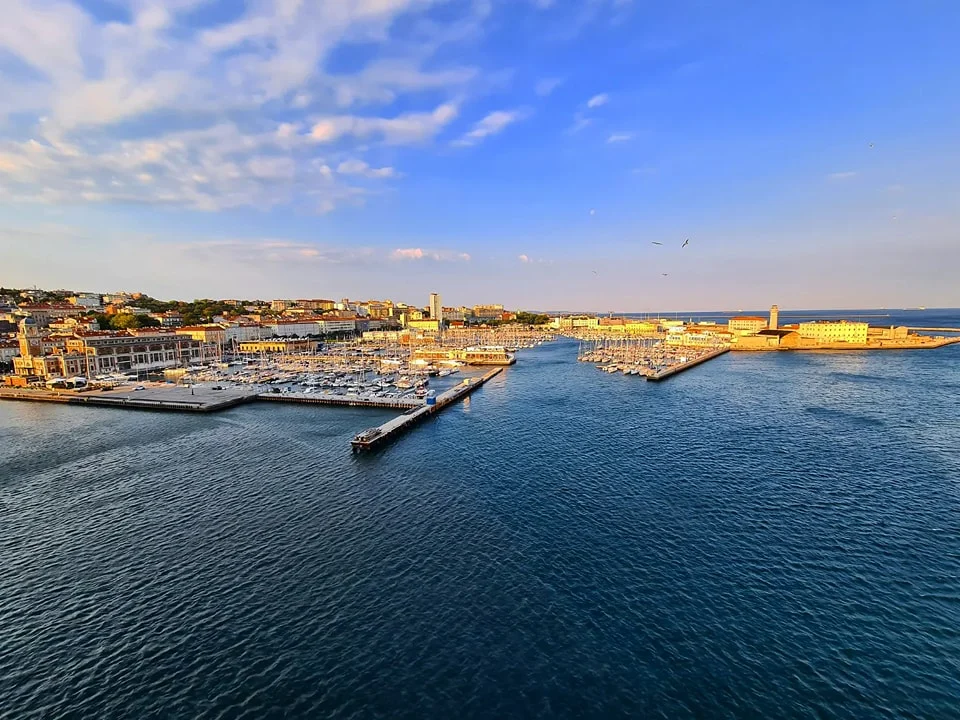 Cruising with Danny and Peter, Holland America Line, Oosterdam, Trieste, Venice, Italy | Stunning views of the Adriatic coastline from our cruise ship, romantic gondola ride through Venice canals, iconic St. Mark’s Basilica, historic Rialto Bridge, and bustling Venetian piazza—all highlights of our Venice Gondola Ride and City Tour during the Adriatic Adventure.