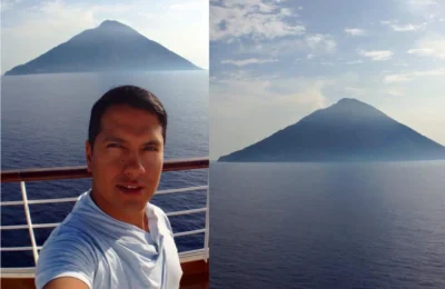 Cruising with Danny and Peter, Holland America Line, Zuiderdam, Messina, Italy | Stunning view of Stromboli volcano erupting at night, vibrant streets of Messina with historic landmarks, breathtaking Strait of Messina views, and highlights of a Mediterranean cruise itinerary featuring Sicily and southern Italy.