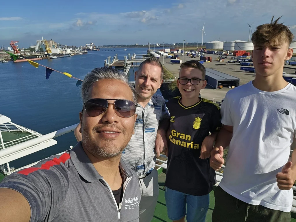 Cruising with Danny and Peter, P&O Ferries, Pride of Rotterdam, Spido, James Cook, Rotterdam, The Netherlands | A stunning Rotterdam mini cruise experience during World Port Days, starting from Beneluxhaven aboard the Pride of Rotterdam, surrounded by massive container ships and barges. Highlights include breathtaking views of the iconic Erasmus Bridge with its swan-like cables over the Nieuwe Maas river, and a sunset scene at Wilhelminakade with its modern skyscrapers and bustling port activities. The evening Spido harbor tour on the James Cook offered an illuminated view of Rotterdam's busy harbor, passing the majestic SS Rotterdam ship, a symbol of the city’s maritime heritage. The day concluded with a vibrant boat parade featuring illuminated vessels, followed by a spectacular fireworks display lighting up the Rotterdam skyline.