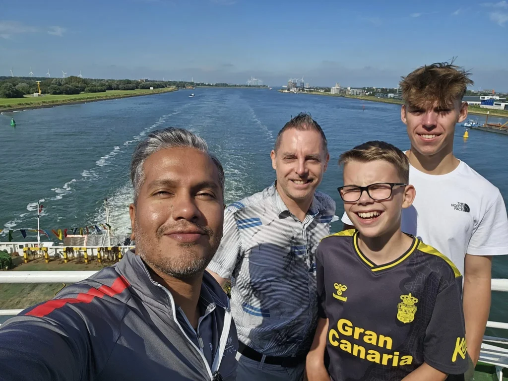Cruising with Danny and Peter, P&O Ferries, Pride of Rotterdam, Spido, James Cook, Rotterdam, The Netherlands | A stunning Rotterdam mini cruise experience during World Port Days, starting from Beneluxhaven aboard the Pride of Rotterdam, surrounded by massive container ships and barges. Highlights include breathtaking views of the iconic Erasmus Bridge with its swan-like cables over the Nieuwe Maas river, and a sunset scene at Wilhelminakade with its modern skyscrapers and bustling port activities. The evening Spido harbor tour on the James Cook offered an illuminated view of Rotterdam's busy harbor, passing the majestic SS Rotterdam ship, a symbol of the city’s maritime heritage. The day concluded with a vibrant boat parade featuring illuminated vessels, followed by a spectacular fireworks display lighting up the Rotterdam skyline.