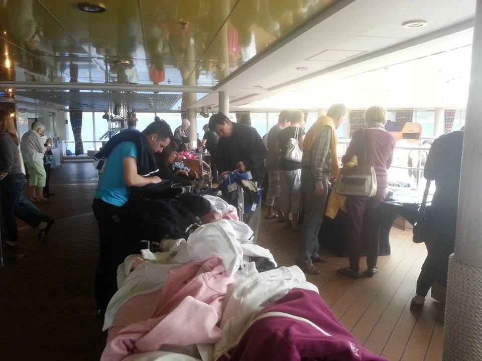 Discovering the Dardanelles: A Comprehensive Guide to Our Holland America Line Dardanelles Cruise Experience 2 Cruising with Danny and Peter, Holland America Line, Ryndam, Turkey, Cruising The Dardanelles | Guests enjoying a Dardanelles cruise experience on Holland America Line's Ryndam, featuring stunning views of the Dardanelles Strait, luxurious onboard dining options with cocktails, and engaging activities during a relaxing day at sea.