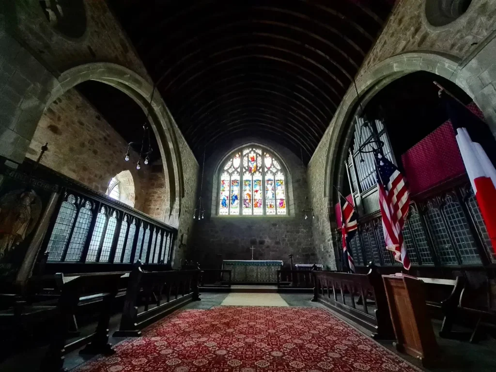 Cruising with Danny and Peter, Holland America Line, Rotterdam, Plymouth, England, Great Britain, United Kingdom | A foggy day in Plymouth Dartmoor showcases an eerie scene of historic churches and spooky graveyards, highlighting the enchanting beauty of Plymouth UK travel. A winding hiking trail through Dartmoor National Park is visible, surrounded by lush greenery and misty landscapes.