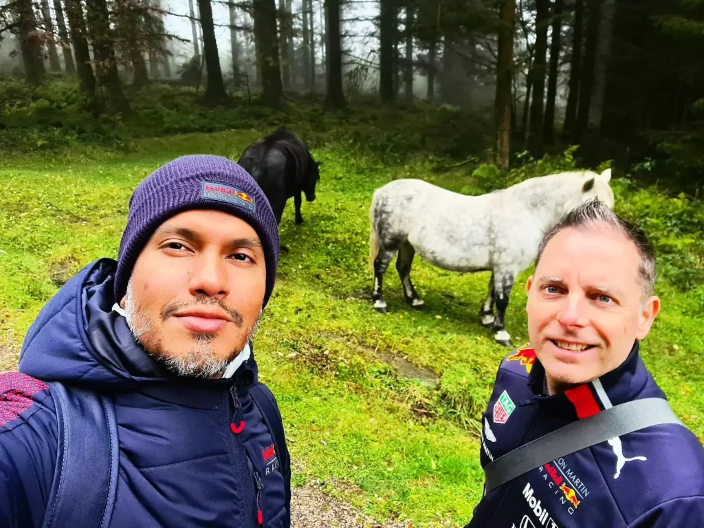 Cruising with Danny and Peter, Holland America Line, Rotterdam, Plymouth, England, Great Britain, United Kingdom | A foggy day in Plymouth Dartmoor showcases an eerie scene of historic churches and spooky graveyards, highlighting the enchanting beauty of Plymouth UK travel. A winding hiking trail through Dartmoor National Park is visible, surrounded by lush greenery and misty landscapes.