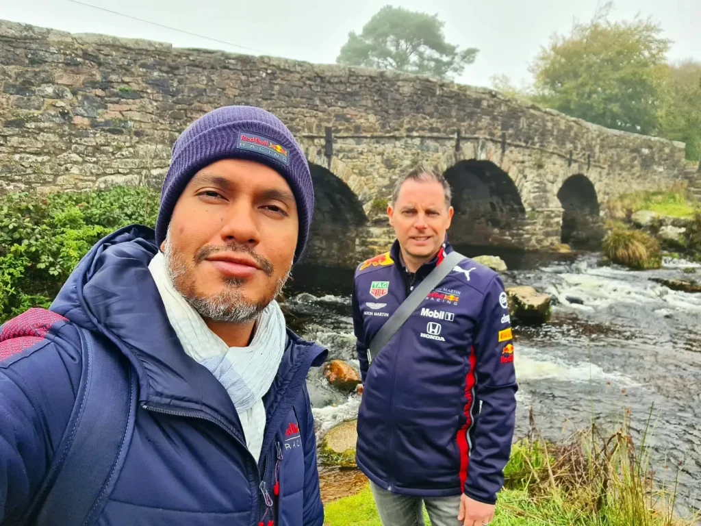 Cruising with Danny and Peter, Holland America Line, Rotterdam, Plymouth, England, Great Britain, United Kingdom | A foggy day in Plymouth Dartmoor showcases an eerie scene of historic churches and spooky graveyards, highlighting the enchanting beauty of Plymouth UK travel. A winding hiking trail through Dartmoor National Park is visible, surrounded by lush greenery and misty landscapes.