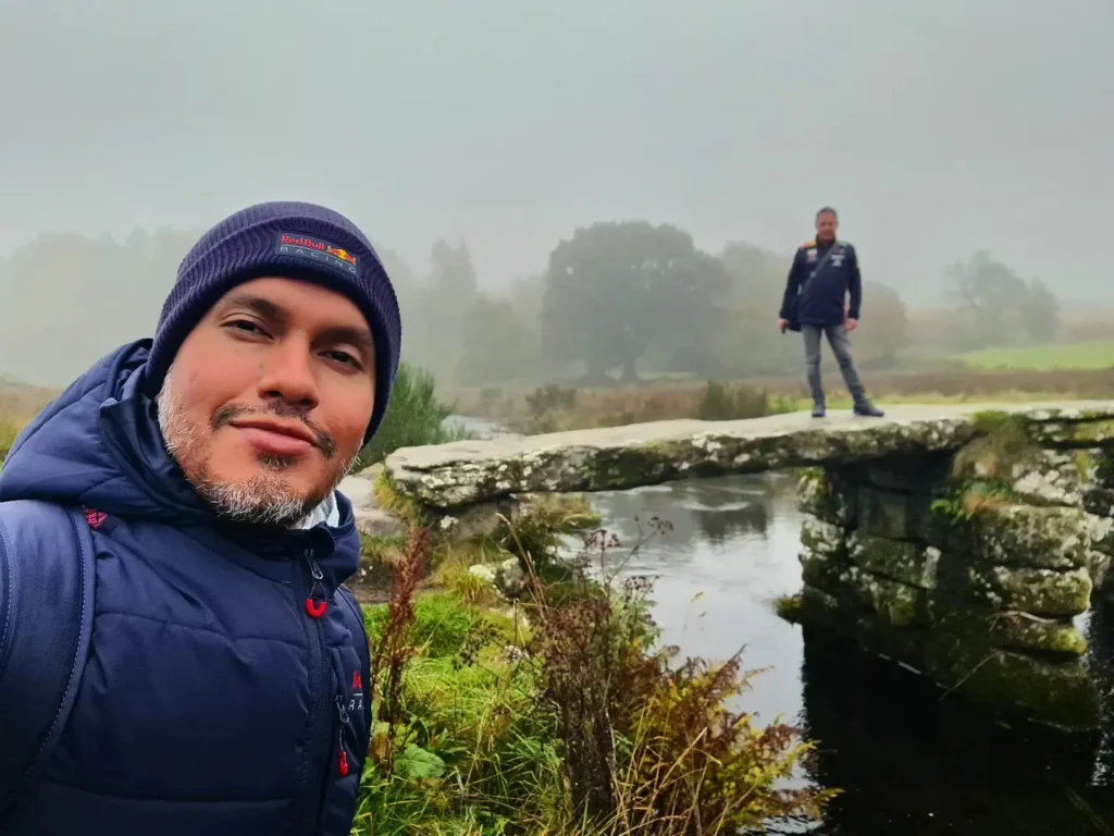 Cruising with Danny and Peter, Holland America Line, Rotterdam, Plymouth, England, Great Britain, United Kingdom | A foggy day in Plymouth Dartmoor showcases an eerie scene of historic churches and spooky graveyards, highlighting the enchanting beauty of Plymouth UK travel. A winding hiking trail through Dartmoor National Park is visible, surrounded by lush greenery and misty landscapes.