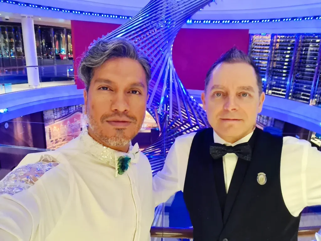 Cruising with Danny and Peter, Holland America Line, Rotterdam, Atlantic Ocean, Sea Day | A beautifully plated dish from the Taste of De Librije dinner aboard the Rotterdam, featuring Jonnie Boer cuisine, including caviar egg, king fish, and oysters, paired with Cloudy Bay Sauvignon Blanc. The elegant dining setup highlights the luxurious atmosphere of Holland America Line's Pinnacle Grill during this exquisite transatlantic cruise dinner.