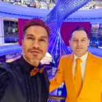 Cruising with Danny and Peter, Holland America Line, Rotterdam, Atlantic Ocean, Sea Day | Guests celebrating the Orange Party Holland America 150th Anniversary aboard the MS Rotterdam, enjoying live music, Dutch treats like Kapsalon, Poffertjes, and Kleine Appeltaart, while wearing orange attire in honor of Dutch heritage and the Holland America anniversary party.