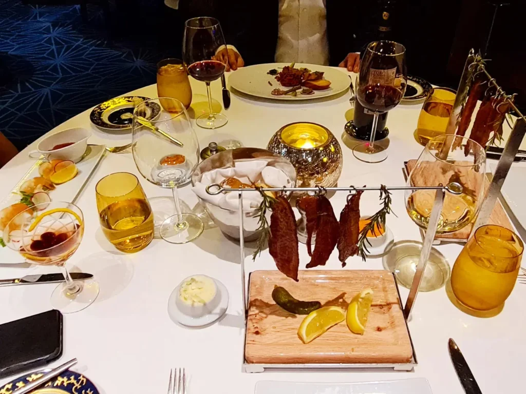 Cruising with Danny and Peter, Holland America Line, Rotterdam, Atlantic Ocean, Sea Day | Exquisite Pinnacle Grill dinner aboard Rotterdam Holland America, featuring gourmet cuisine like crab cakes, filet mignon, halibut, key lime pie, and luxury cruise dining experience at the Pinnacle Grill Holland America.