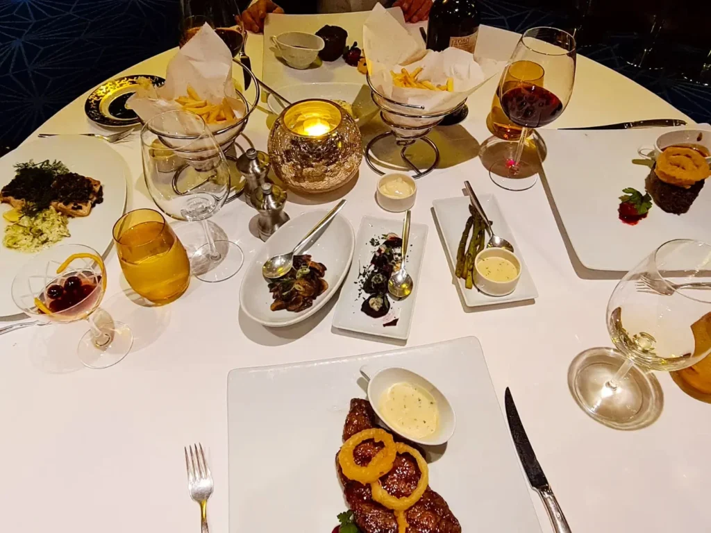 Cruising with Danny and Peter, Holland America Line, Rotterdam, Atlantic Ocean, Sea Day | Exquisite Pinnacle Grill dinner aboard Rotterdam Holland America, featuring gourmet cuisine like crab cakes, filet mignon, halibut, key lime pie, and luxury cruise dining experience at the Pinnacle Grill Holland America.